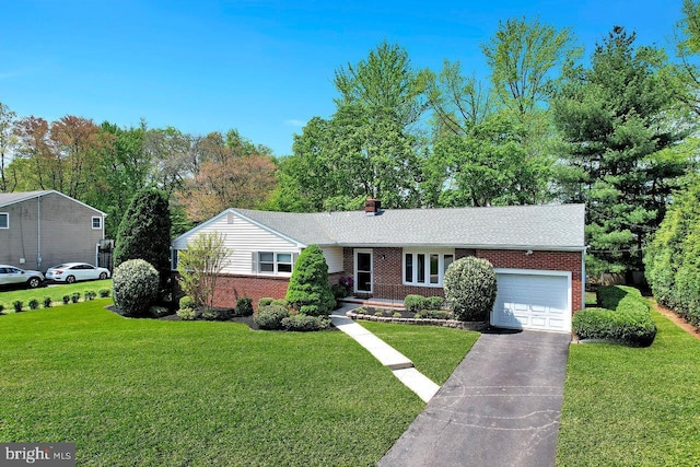 ranch-style home featuring a garage, a front yard, aphalt driveway, and brick siding