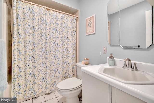 bathroom featuring toilet, tile patterned floors, a shower with curtain, and vanity