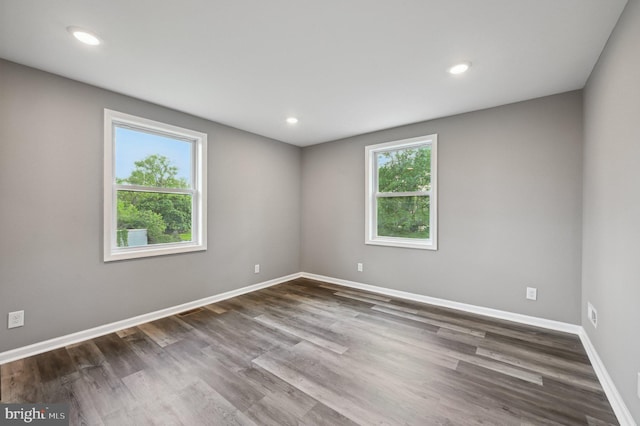 1954 Sponson St, Baltimore, MD 21230 - unfurnished room featuring dark wood-style flooring, baseboards, and recessed lighting