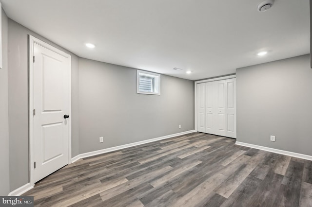 1954 Sponson St, Baltimore, MD 21230 - unfurnished bedroom featuring dark wood-style flooring, baseboards, a closet, and recessed lighting