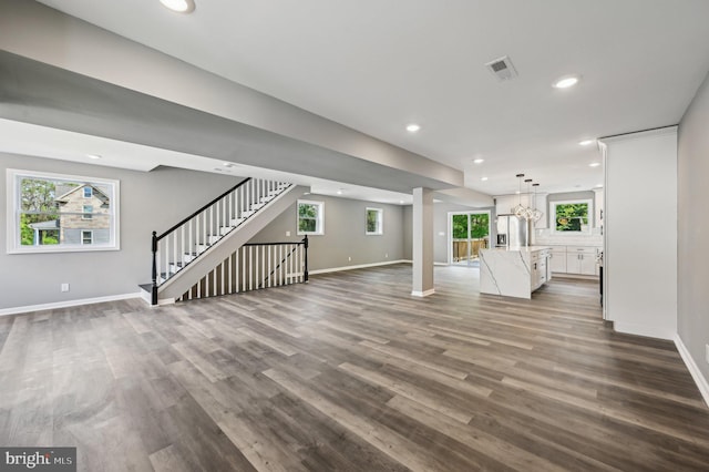 1954 Sponson St, Baltimore, MD 21230 - unfurnished living room with recessed lighting, dark wood-style floors, baseboards, visible vents, and ornate columns