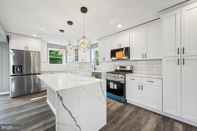 1954 Sponson St, Baltimore, MD 21230 - kitchen with dark wood-style flooring, recessed lighting, white cabinetry, and appliances with stainless steel finishes