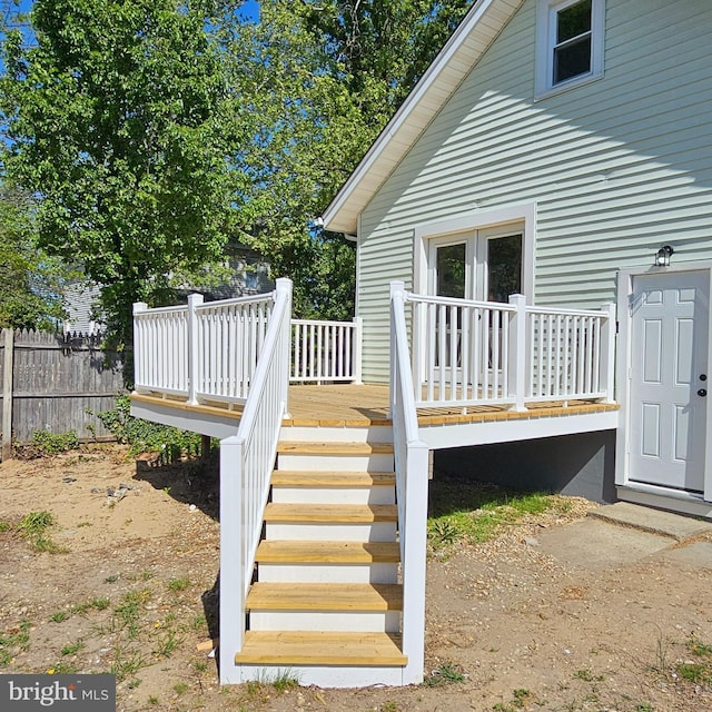 deck with fence and stairs