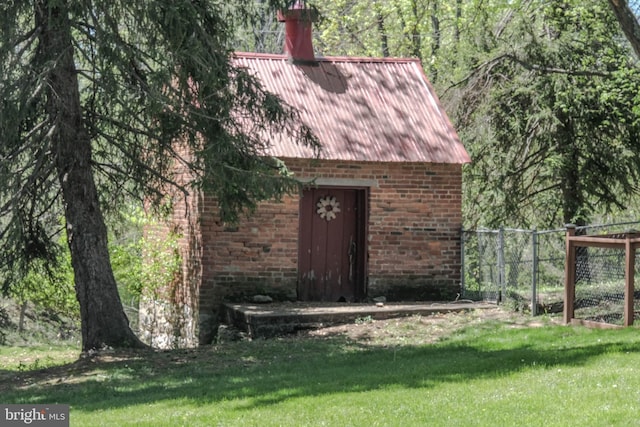 view of outdoor structure featuring fence