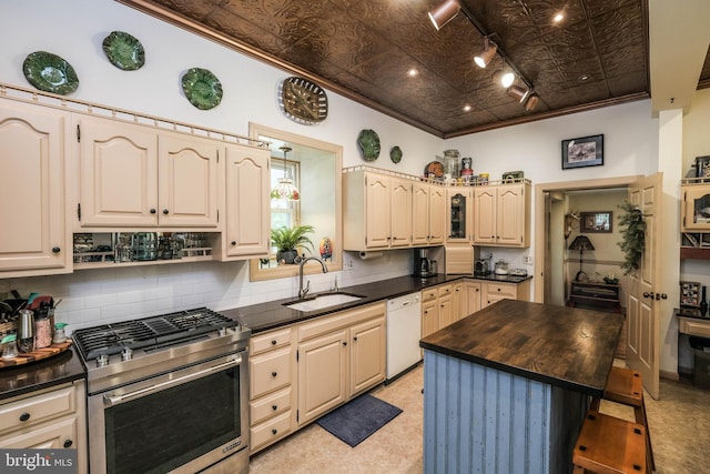 kitchen featuring white dishwasher, a sink, an ornate ceiling, gas range, and ornamental molding