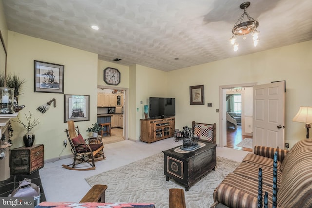 living room with light colored carpet and visible vents