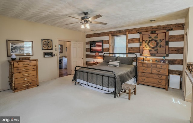 bedroom featuring ceiling fan and light colored carpet