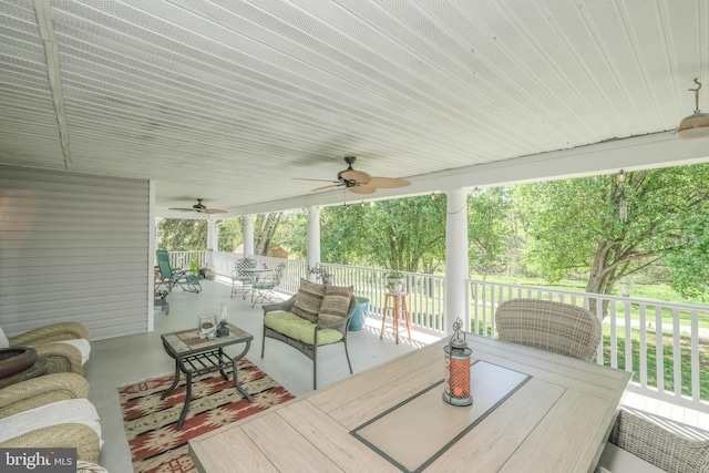 deck featuring a ceiling fan and outdoor dining area