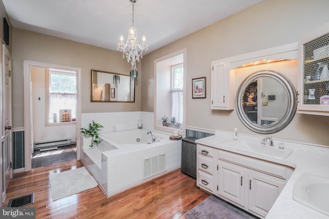 full bath featuring visible vents, an inviting chandelier, and wood finished floors