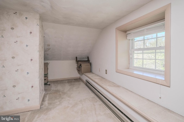 bonus room with light colored carpet, baseboards, lofted ceiling, and baseboard heating