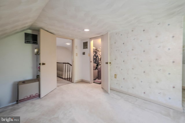 bonus room featuring baseboards and carpet