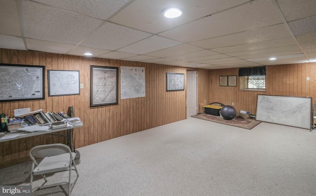 interior space featuring recessed lighting, wood walls, a paneled ceiling, and carpet