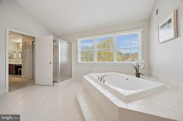 full bathroom featuring vanity, a shower stall, lofted ceiling, visible vents, and a bath