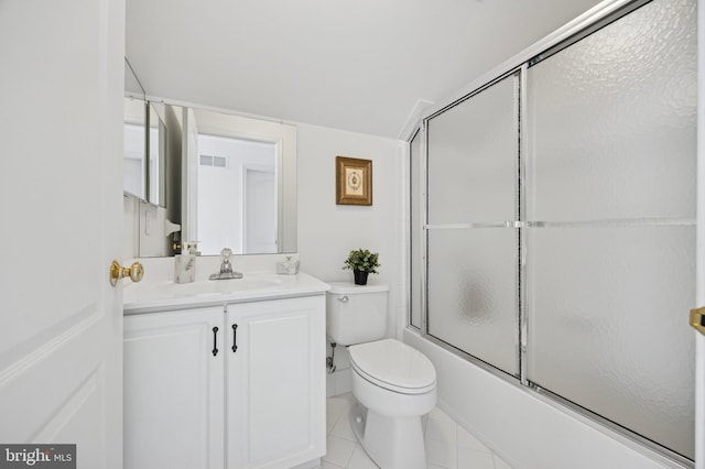 full bath with shower / bath combination with glass door, vanity, toilet, tile patterned floors, and visible vents