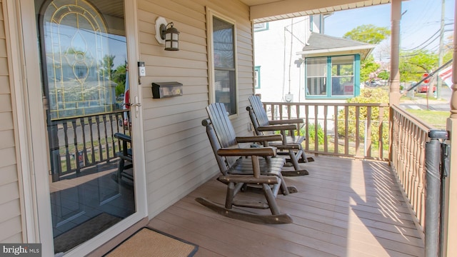 wooden deck with a porch