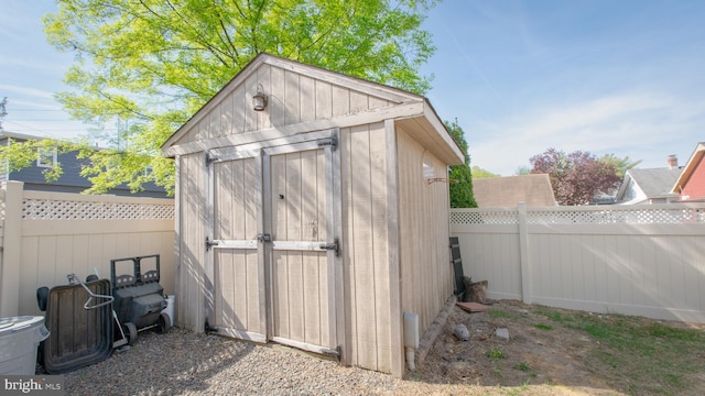 view of shed featuring a fenced backyard