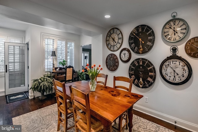 dining area featuring recessed lighting, baseboards, dark wood finished floors, and plenty of natural light