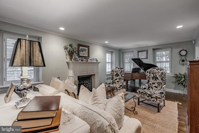 living area featuring crown molding, recessed lighting, and wood finished floors
