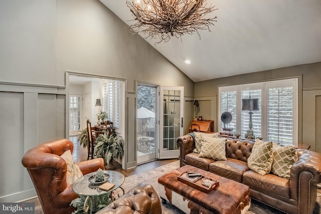 living area featuring recessed lighting, wood finished floors, a chandelier, and high vaulted ceiling