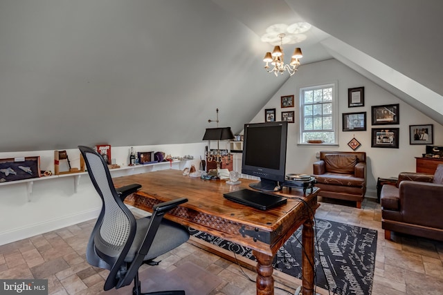 office area with baseboards, a notable chandelier, lofted ceiling, and stone tile floors