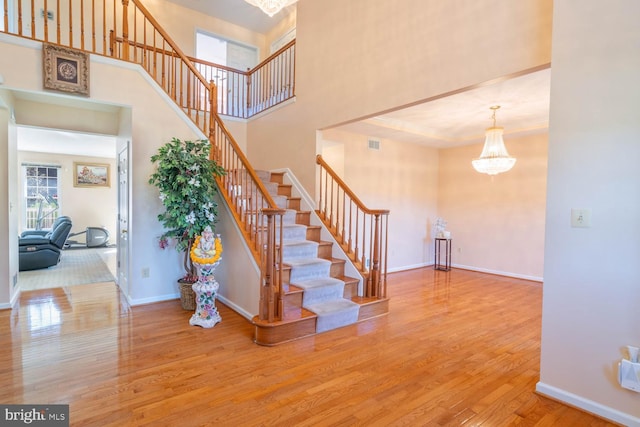 1249 Canon Way, Westminster, MD 21157 - stairway with baseboards, a high ceiling, a chandelier, and wood finished floors
