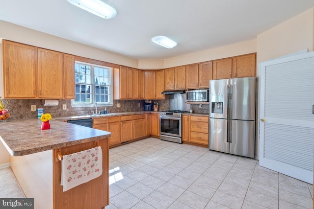 1249 Canon Way, Westminster, MD 21157 - kitchen with a peninsula, light tile patterned flooring, under cabinet range hood, tasteful backsplash, and appliances with stainless steel finishes