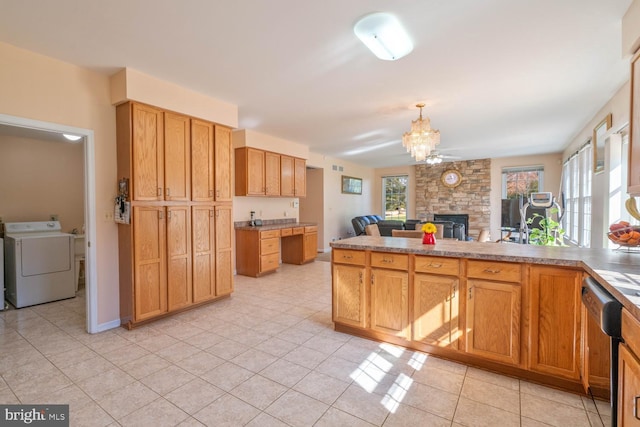 1249 Canon Way, Westminster, MD 21157 - kitchen featuring stainless steel dishwasher, an inviting chandelier, a fireplace, open floor plan, and washer / clothes dryer