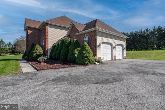 1249 Canon Way, Westminster, MD 21157 - view of home's exterior with a garage, a yard, aphalt driveway, and brick siding