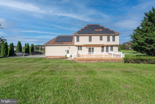 1249 Canon Way, Westminster, MD 21157 - rear view of house with a lawn, a deck, and roof mounted solar panels