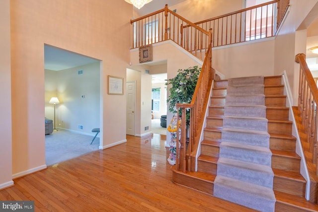 1249 Canon Way, Westminster, MD 21157 - stairway with wood finished floors, baseboards, a high ceiling, and visible vents