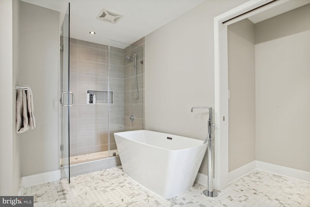 bathroom featuring visible vents, recessed lighting, a stall shower, and a soaking tub