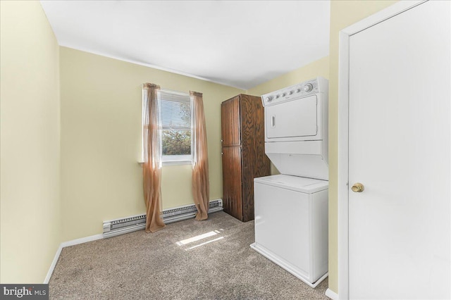 laundry area featuring laundry area, stacked washer / dryer, baseboards, baseboard heating, and carpet flooring