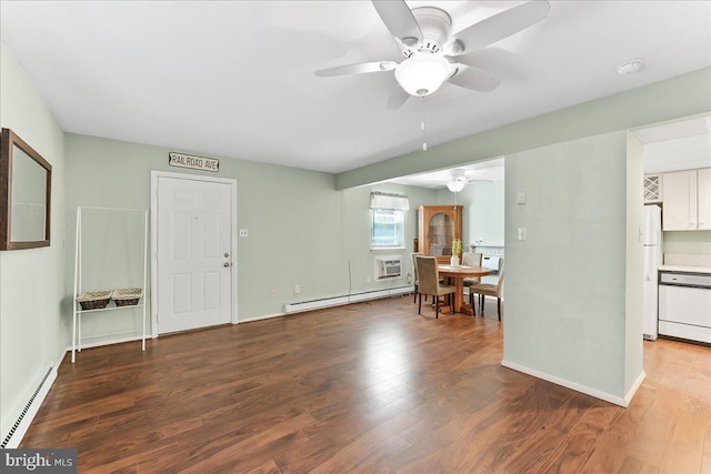 living area featuring a ceiling fan, a baseboard heating unit, and wood finished floors
