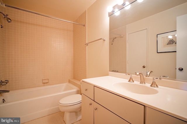 full bath with tile patterned flooring, washtub / shower combination, toilet, and vanity