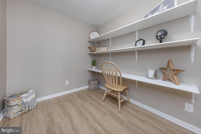 home office featuring light wood-type flooring and baseboards