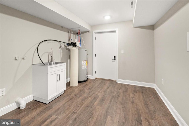 7746 Emerson Burrier Rd, Mount Airy, MD 21771 - washroom with visible vents, wood finished floors, baseboards, electric water heater, and a sink
