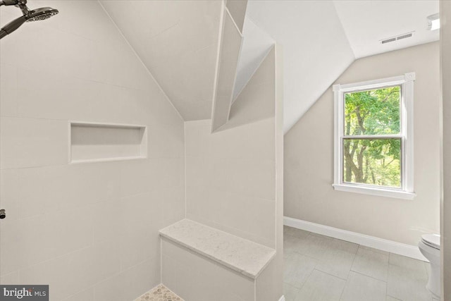 7746 Emerson Burrier Rd, Mount Airy, MD 21771 - bathroom with toilet, baseboards, lofted ceiling, visible vents, and tiled shower