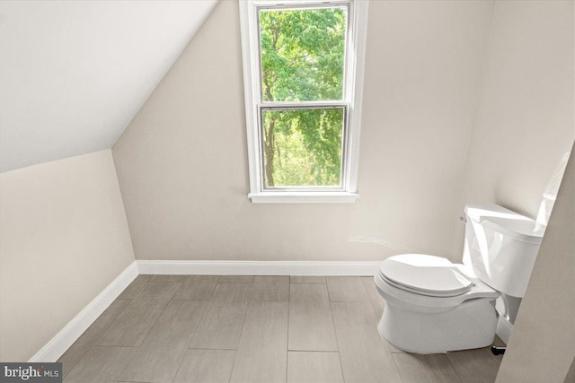 7746 Emerson Burrier Rd, Mount Airy, MD 21771 - bathroom with baseboards, vaulted ceiling, and toilet