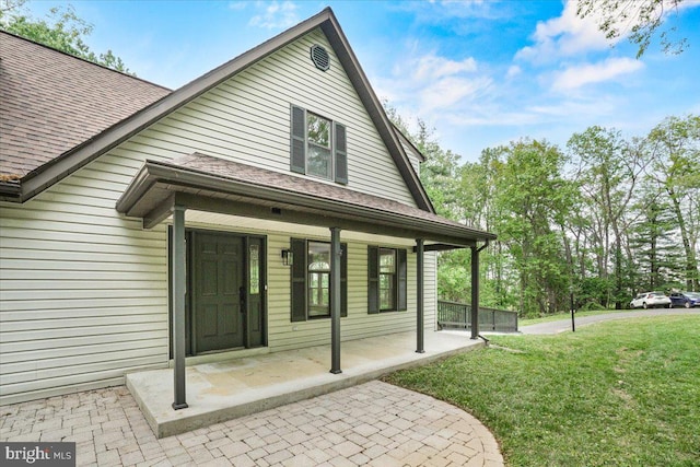 7746 Emerson Burrier Rd, Mount Airy, MD 21771 - entrance to property featuring a shingled roof, a yard, and a porch