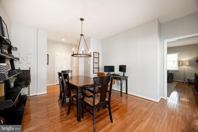 dining room featuring baseboards, light wood-style floors, a chandelier, and recessed lighting