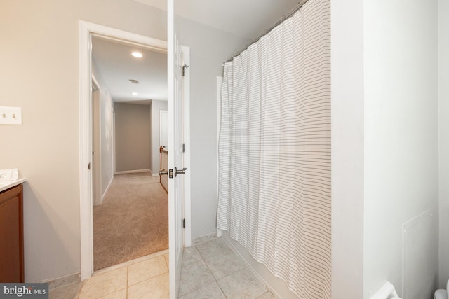 bathroom featuring vanity, curtained shower, recessed lighting, tile patterned flooring, and baseboards