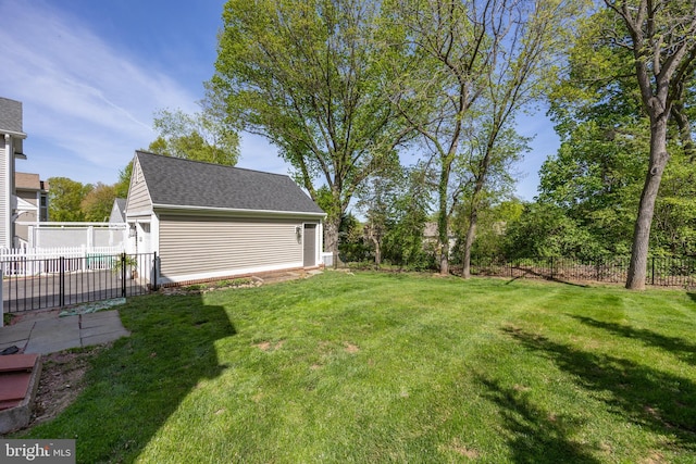 view of yard with an outdoor structure and fence