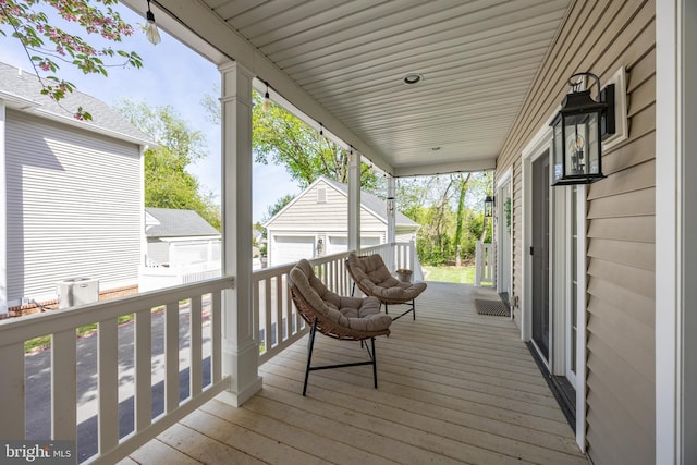 wooden terrace featuring an outdoor structure