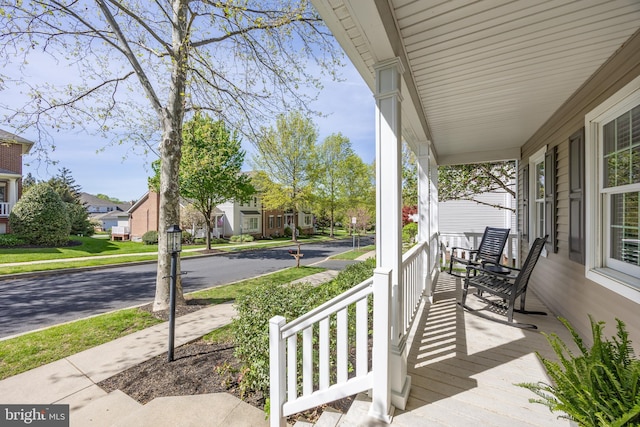 view of patio / terrace with covered porch and a residential view