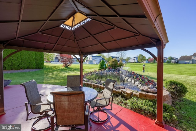view of patio / terrace with a gazebo and outdoor dining space