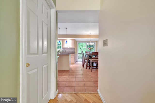 corridor featuring light tile patterned flooring