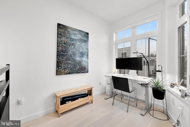 office with baseboards and wood finished floors