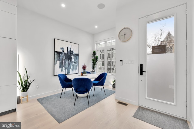 dining room with baseboards, recessed lighting, light wood-style flooring, and visible vents