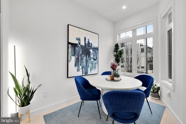 dining area featuring recessed lighting and baseboards