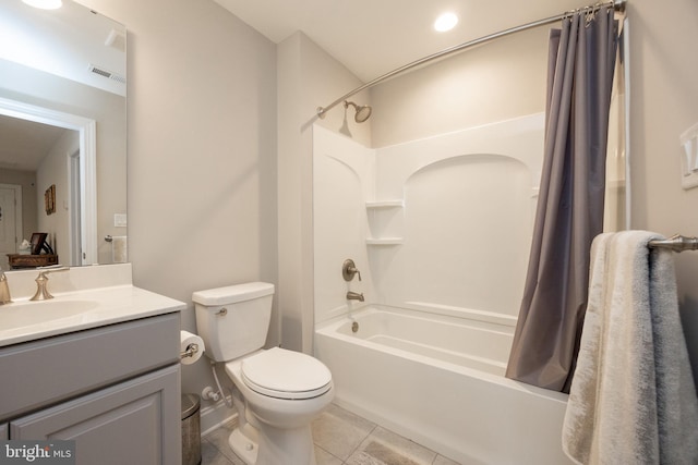 bathroom featuring visible vents, tile patterned flooring, shower / tub combo, vanity, and toilet